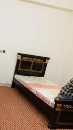 Simple wooden single bed